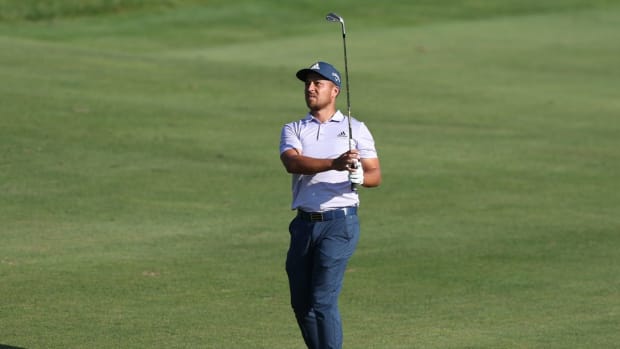 Jun 26, 2022; Cromwell, Connecticut, USA; Xander Schauffele plays a shot from the fairway of the 18th hole during the final round of the Travelers Championship golf tournament. Mandatory Credit: Vincent Carchietta-USA TODAY Sports